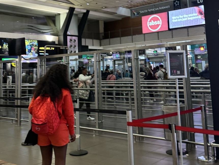 Traveller approaching airport queues at a South African airport